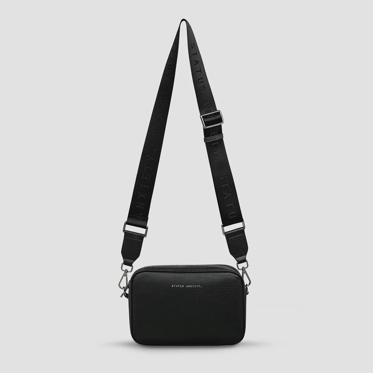 Status Anxiety Plunder Bag in Black with Webbed Strap